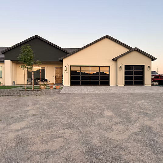 A modern home with two garage doors.